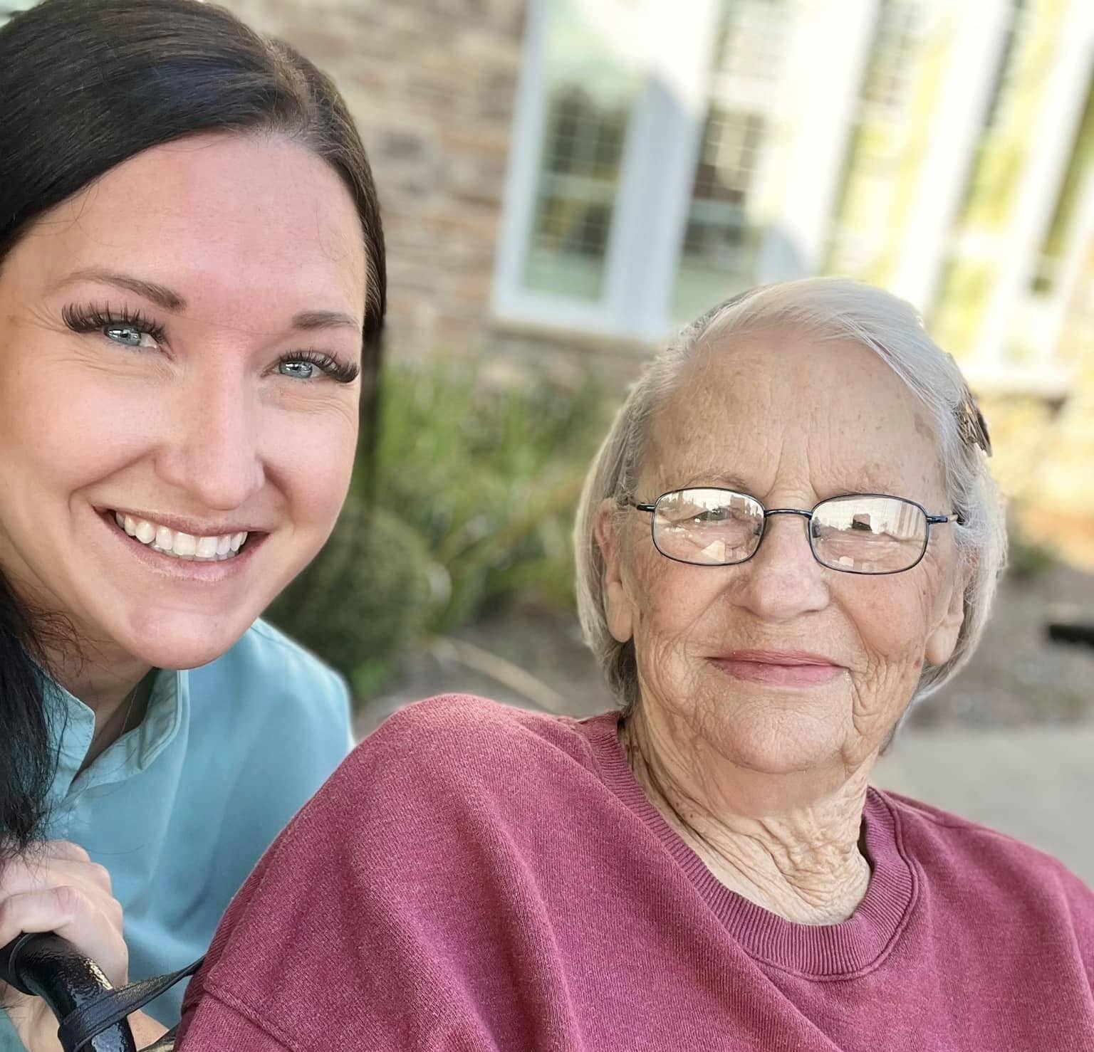 Nurse caring for an elderly woman at Alpine Skilled Nursing and Rehabilitation