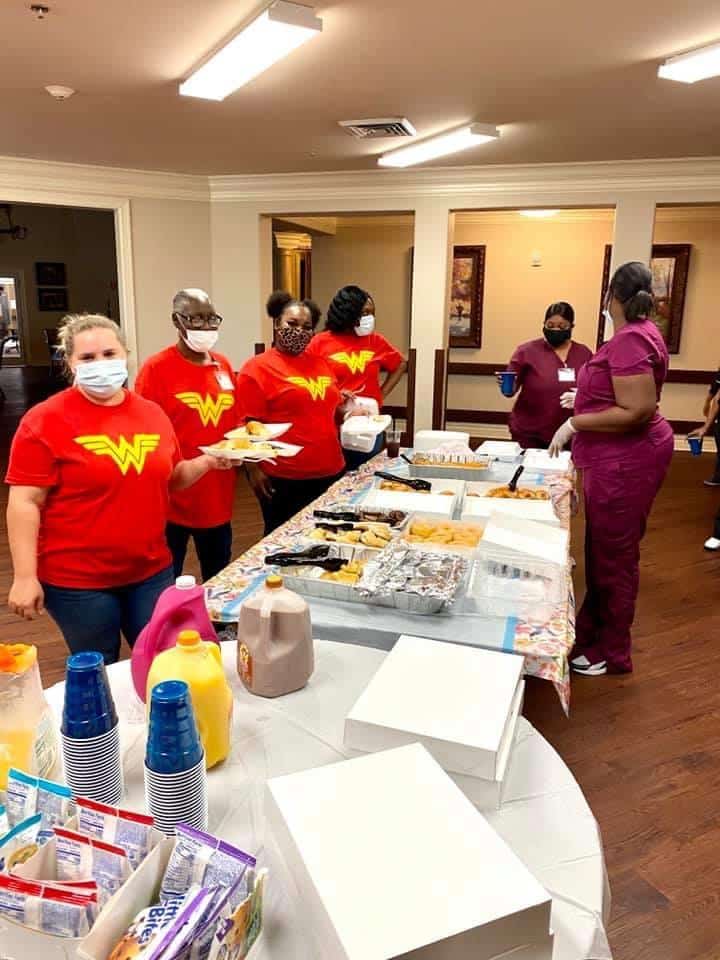 Nurses serving food to patients at Alpine Skilled Nursing with proper hygiene in Ruston, LA.